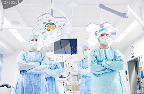 Image of group of surgeons in operating room at hospital