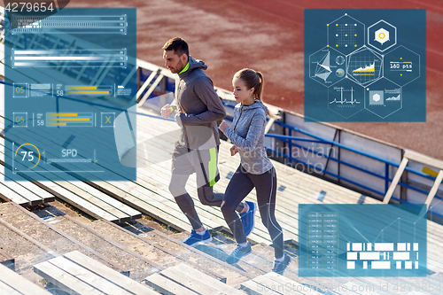 Image of sporty couple running upstairs on stadium