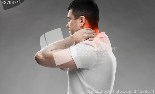 Image of close up of man suffering from neck pain