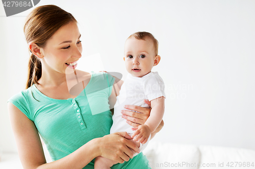 Image of happy young mother with little baby at home