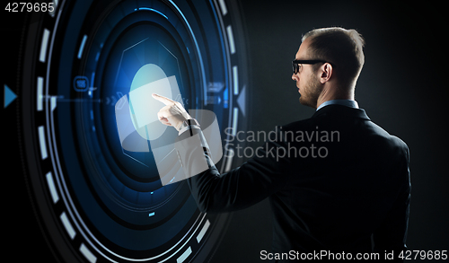 Image of businessman pointing finger to