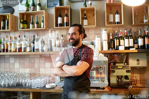 Image of happy man, barman or waiter at bar