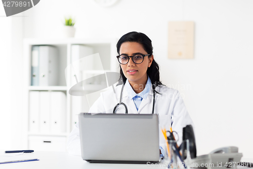 Image of female doctor with laptop at hospital