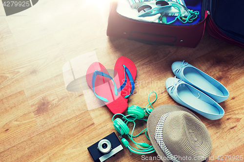 Image of close up of travel bag with clothes and stuff