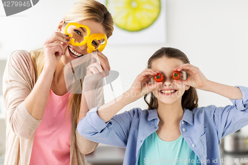 Image of happy family cooking and having fun at kitchen