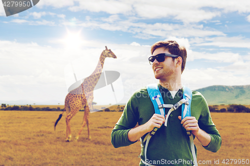 Image of happy man with backpack traveling in africa