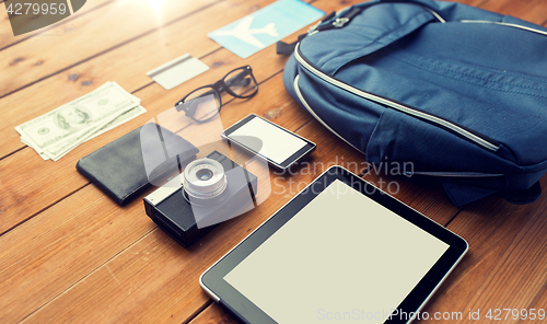 Image of close up of smartphone and travel stuff