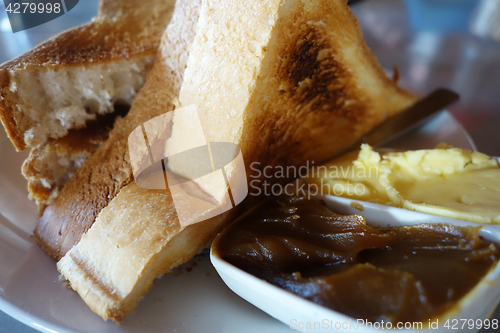 Image of French toast with butter and kaya