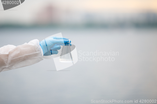 Image of Hand on blurred gray background