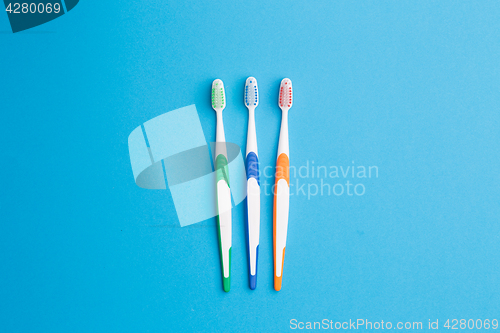 Image of Three toothbrushes, place for inscription