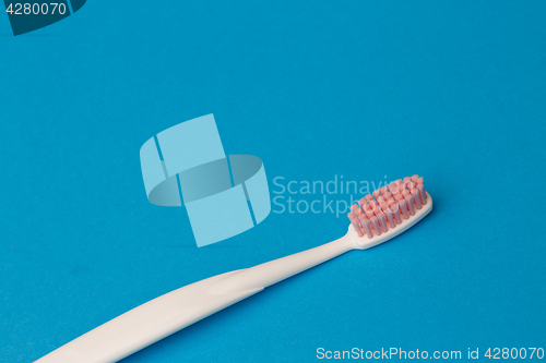 Image of Photo of one pink toothbrush