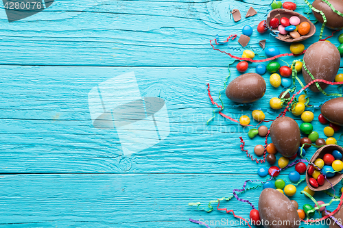 Image of Blue wooden table , chocolate eggs