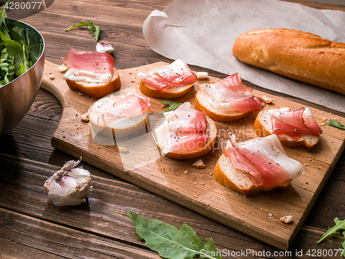 Image of Wooden cutting board with bacon