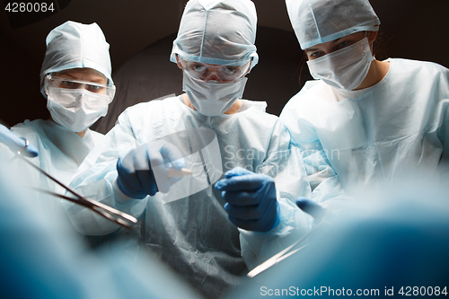 Image of Photo of surgeons with instruments