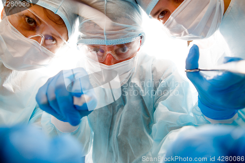 Image of Team of surgeons at work