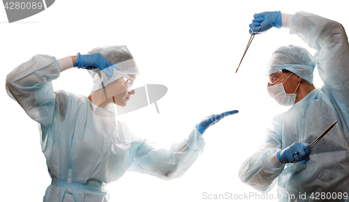 Image of Fight of doctors with tools