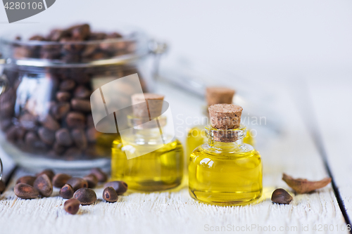 Image of The cedar oil in a glass bottle