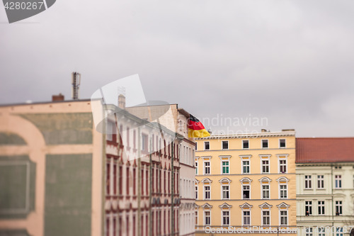 Image of German flag flying from the roof of a building