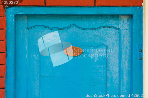 Image of Wooden door with number sign