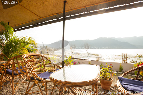 Image of Tables at a cafe next to lake