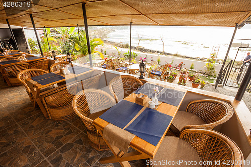 Image of Tables at a cafe next to lake