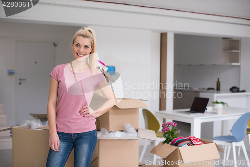 Image of girl moving in the new apartment