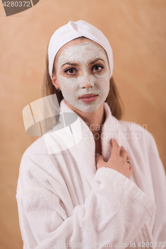 Image of Spa Woman applying Facial Mask