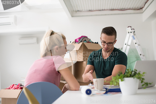 Image of Young couple moving in a new home