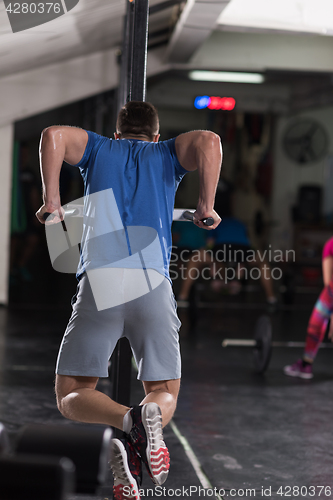 Image of man doing exercises parallel bars