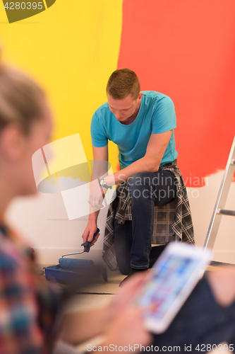 Image of couple doing home renovations