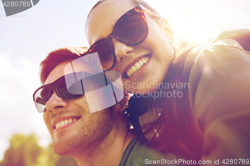 Image of happy couple having fun outdoors