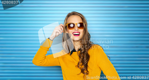 Image of happy young woman or teen girl in sunglasses