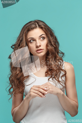 Image of The young woman\'s portrait with thoughtful emotions