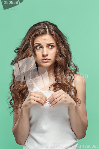 Image of The young woman\'s portrait with thoughtful emotions