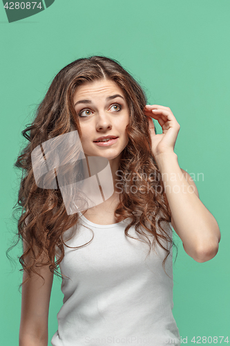 Image of The young woman\'s portrait with thoughtful emotions