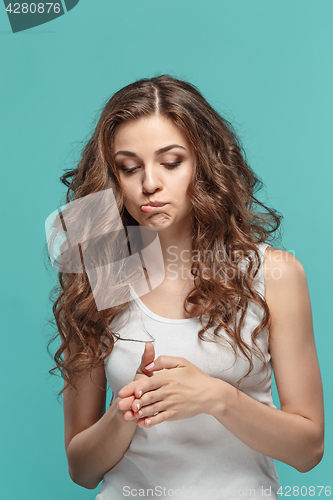 Image of The young woman\'s portrait with thoughtful emotions