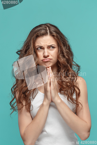 Image of The young woman\'s portrait with thoughtful emotions