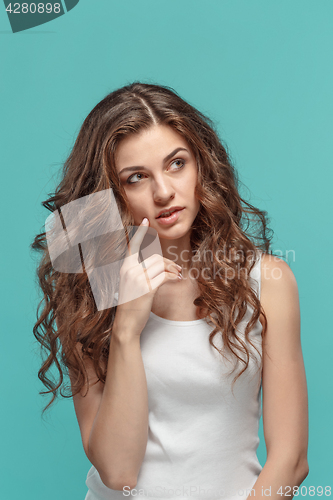 Image of The young woman\'s portrait with thoughtful emotions