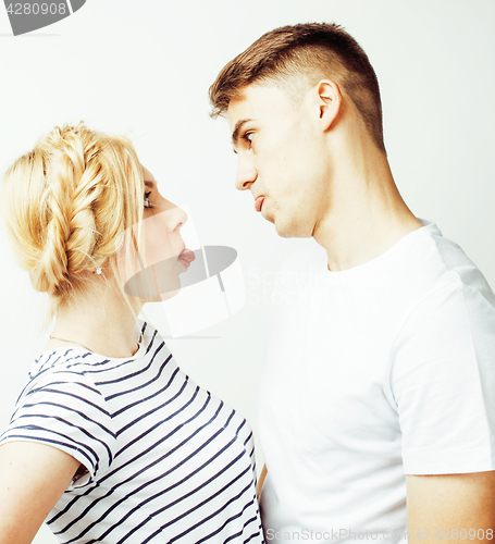 Image of young pretty teenage couple, hipster guy with his girlfriend happy smiling and hugging isolated on white background, lifestyle people concept