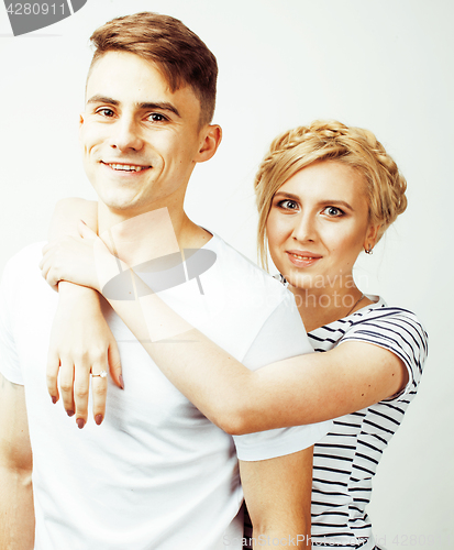 Image of young pretty teenage couple, hipster guy with his girlfriend happy smiling and hugging isolated on white background, lifestyle people concept