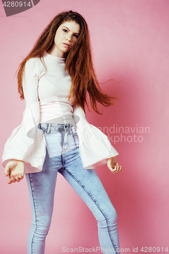 Image of cute pretty redhair teenage girl smiling cheerful on pink background, lifestyle modern people concept 