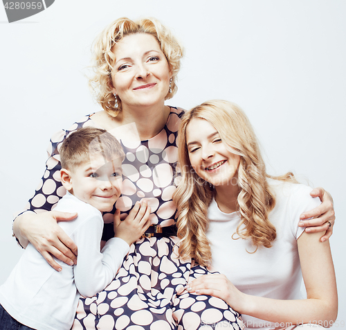 Image of happy smiling family together posing cheerful on white background, lifestyle people concept, mother with son and teenage daughter isolated 