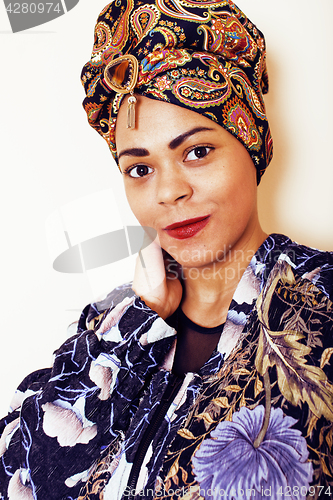 Image of beauty bright african woman with creative make up, shawl on head like cubian closeup smiling, cheerful tan mulatto, lifestyle people concept