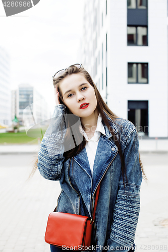 Image of young pretty hipster girl student with coffee cup posing adorable smiling, lifestyle people concept outdoor