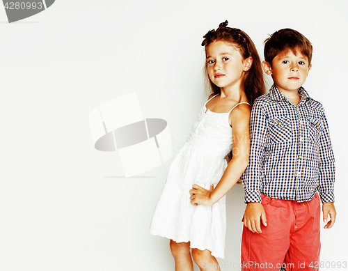 Image of little cute boy and girl hugging playing on white background, ha