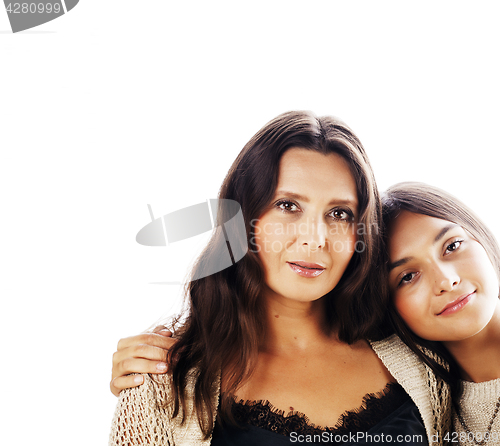 Image of cute pretty teen daughter with mature mother hugging, fashion st