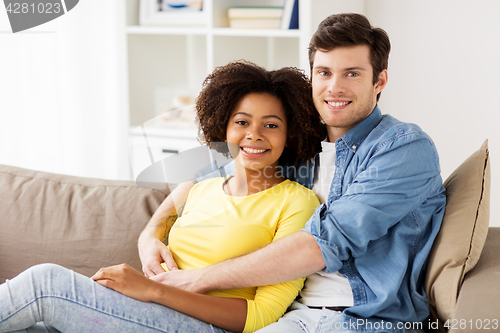 Image of happy smiling international couple at home