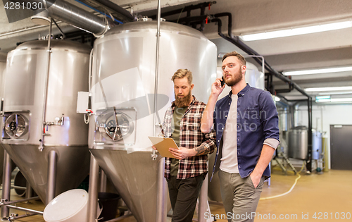 Image of men working at craft brewery or beer plant