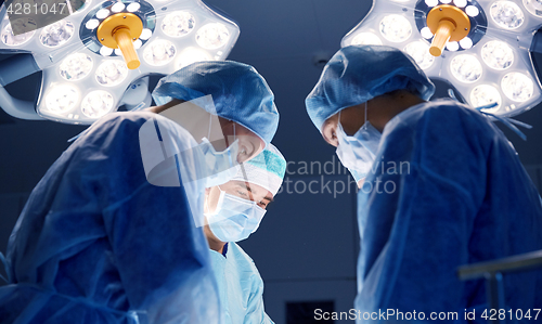 Image of group of surgeons in operating room at hospital