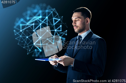 Image of businessman with tablet pc and network projection